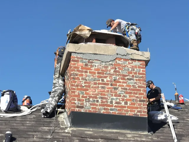 Brookfield Chimney Sweep installing a custom chimney crown in Brookfield, CT