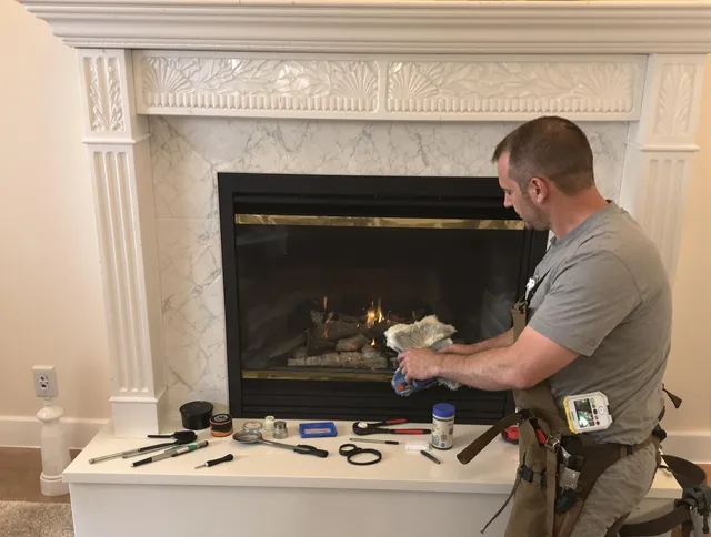 Brookfield Chimney Sweep performing fireplace maintenance in Brookfield, CT