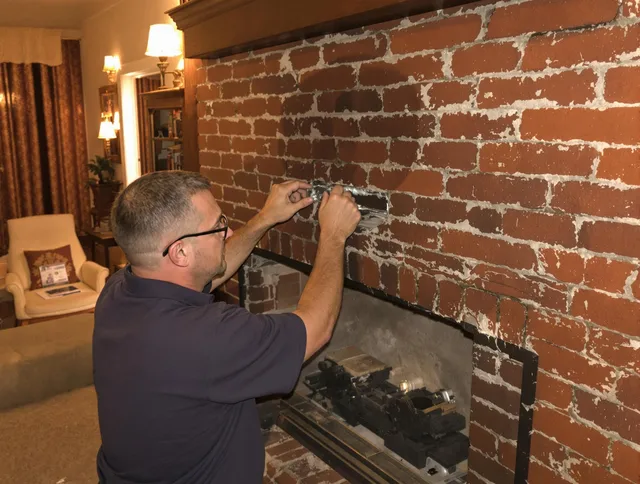Brookfield Chimney Sweep expert fixing a fireplace in Brookfield, CT